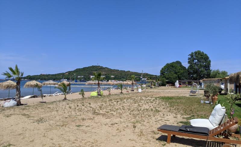 Photo of Ailyak campming beach with bright sand surface