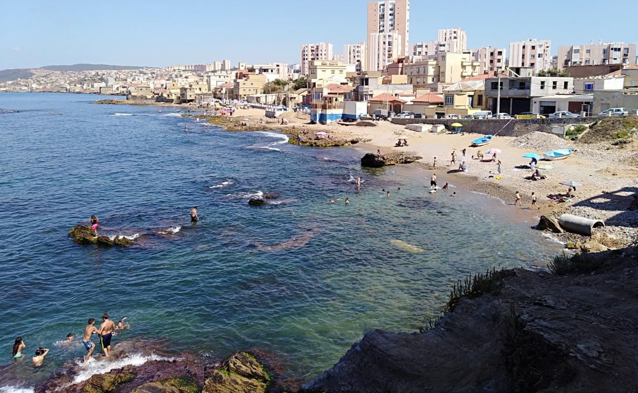 Photo of Plage de lilot with bright sand & rocks surface