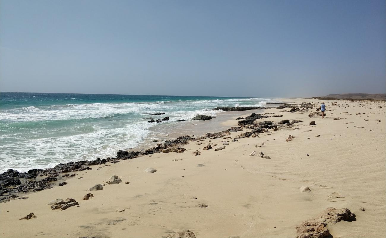 Photo of Joao Barrosa Beach with bright sand & rocks surface