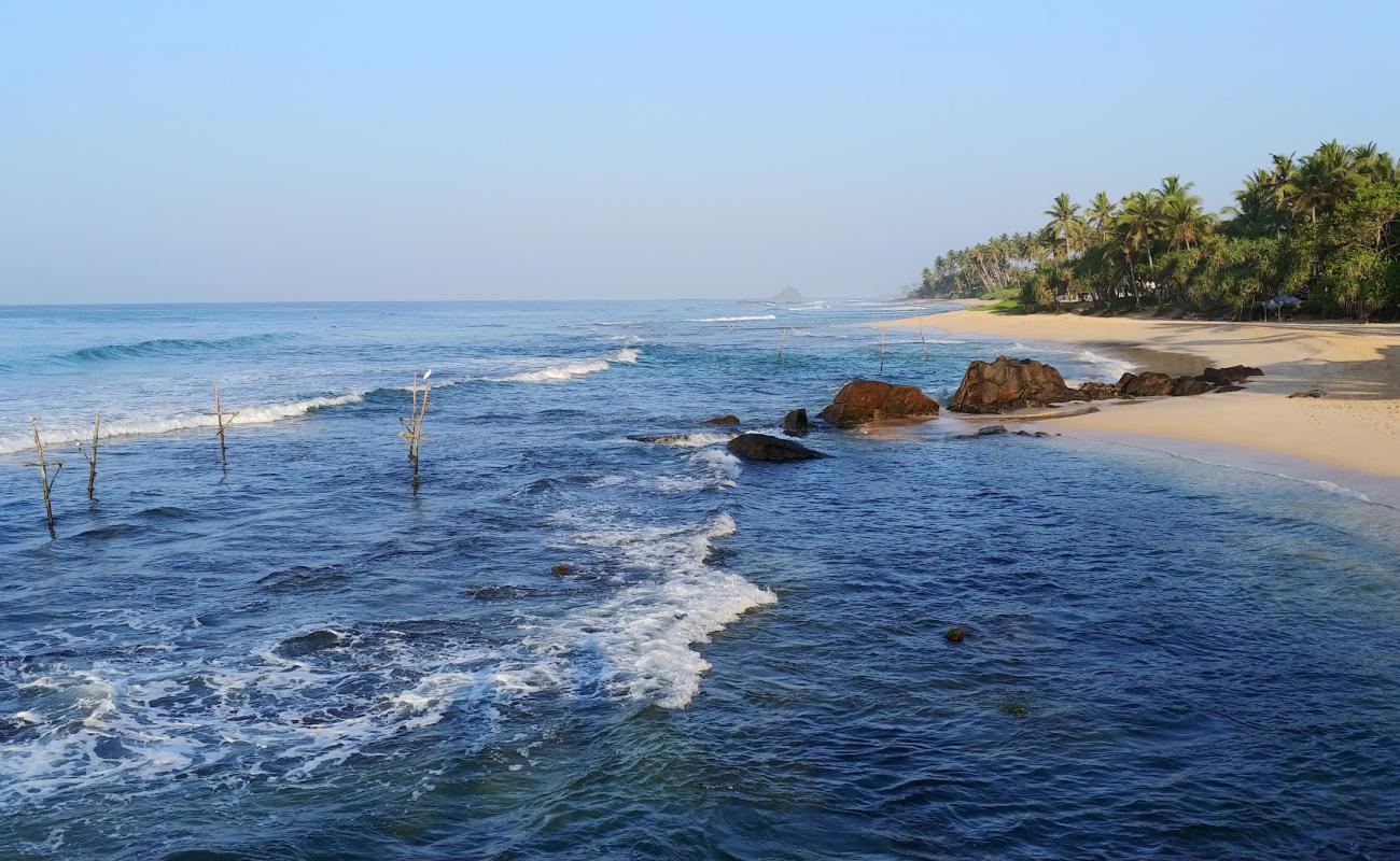 Photo of Coconut Beach with bright sand & rocks surface