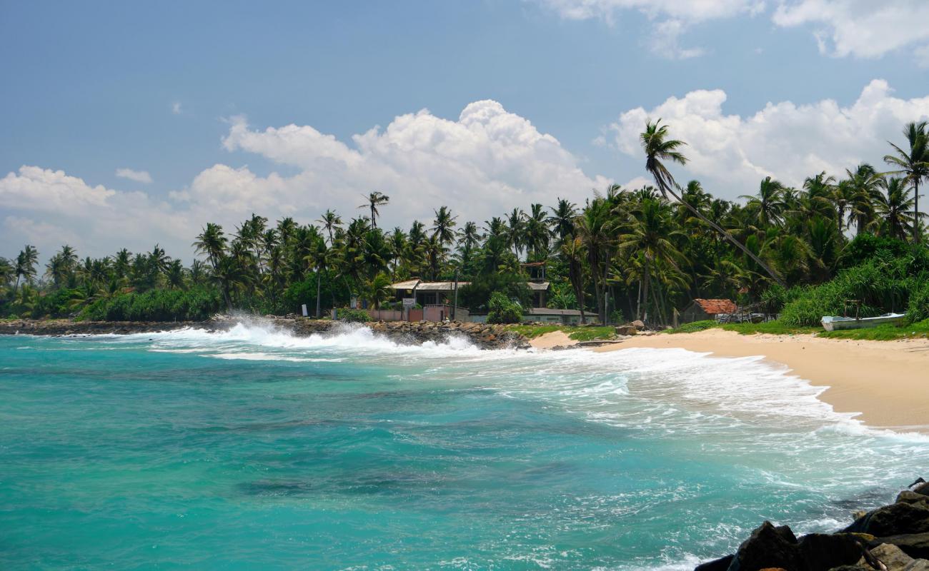 Photo of Ahangama Beach with bright sand & rocks surface