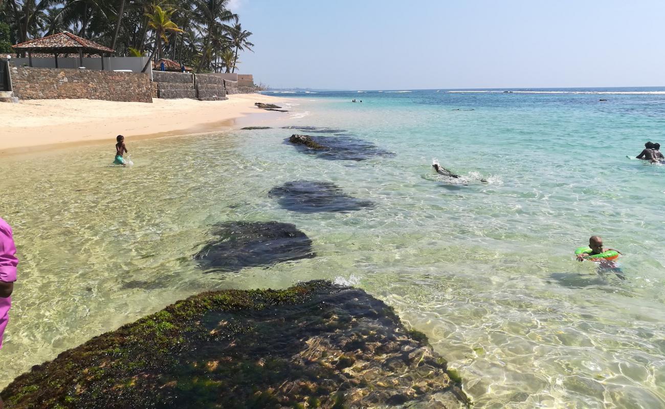 Photo of Heenwella beach with bright sand & rocks surface