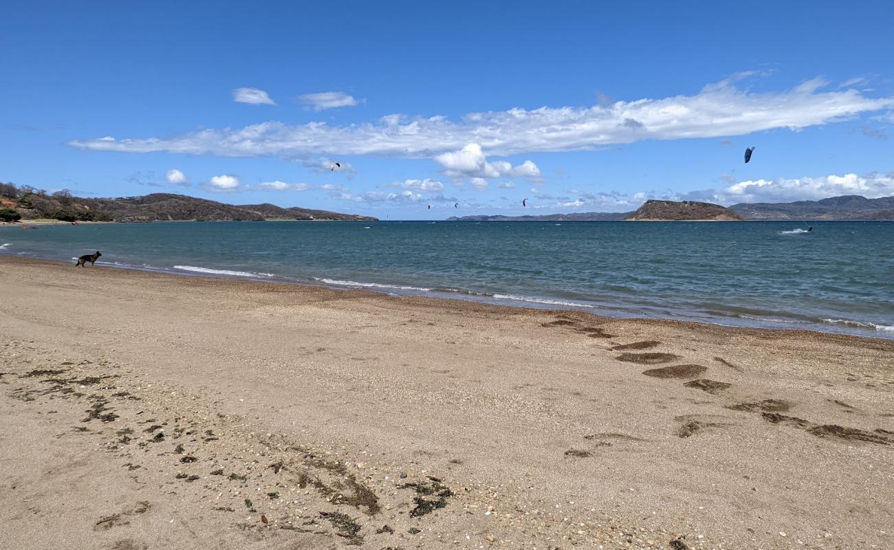 Photo of Copal beach with bright shell sand surface