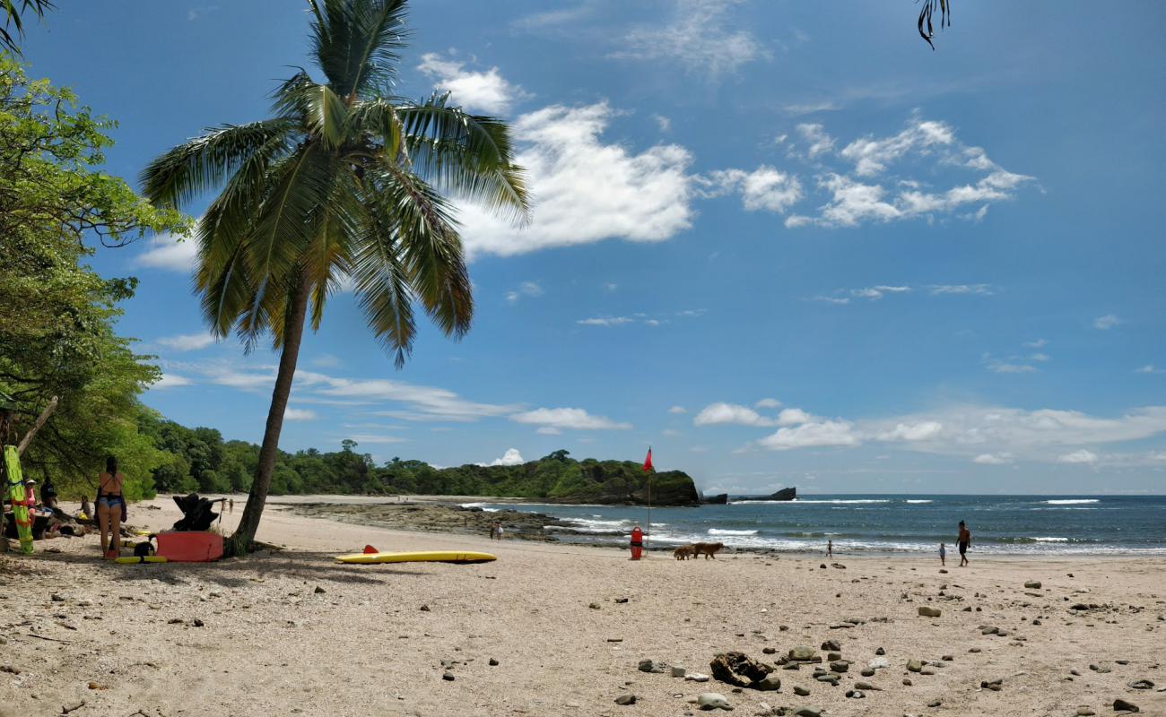 Photo of Playa Pelada with bright sand & rocks surface