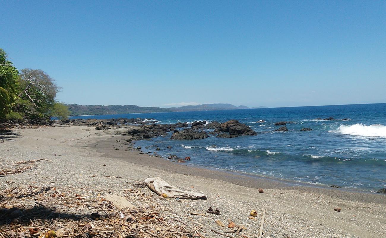 Photo of Playa Los Cedros with bright sand & rocks surface