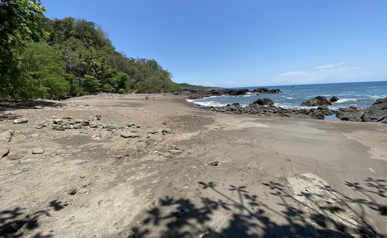 Photo of Piedra Colorada with brown sand &  rocks surface