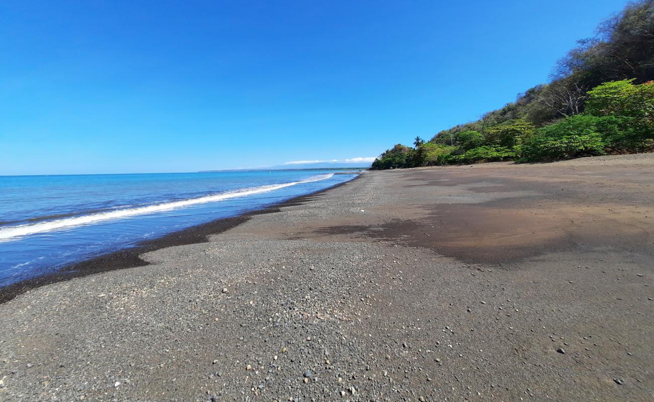 Photo of Playa Pogeres with brown sand surface