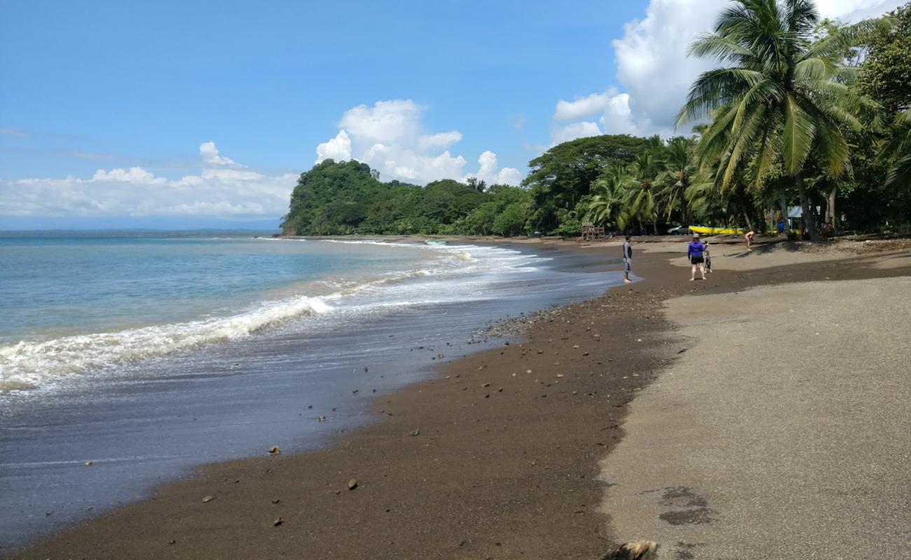 Photo of Playa Agujas with black sand & pebble surface