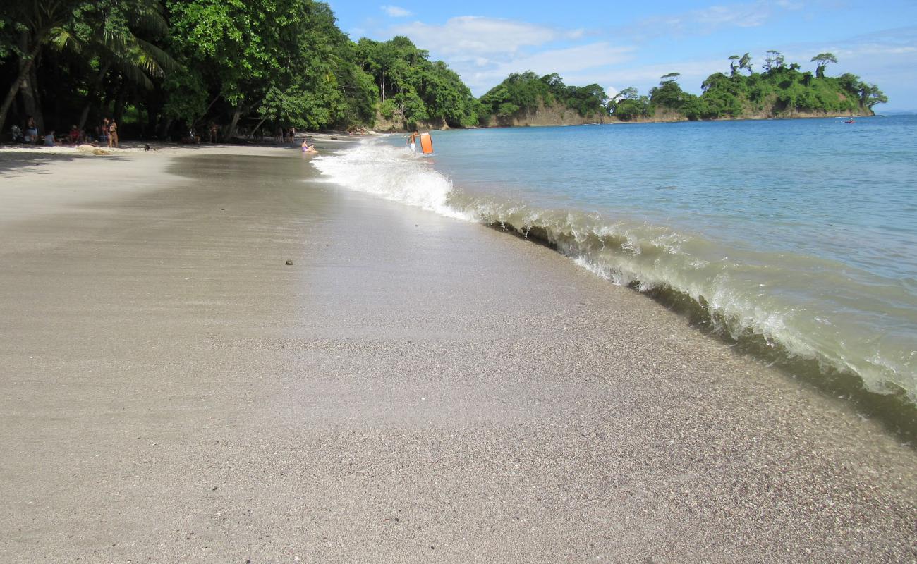 Photo of Playa Mantas with gray sand surface