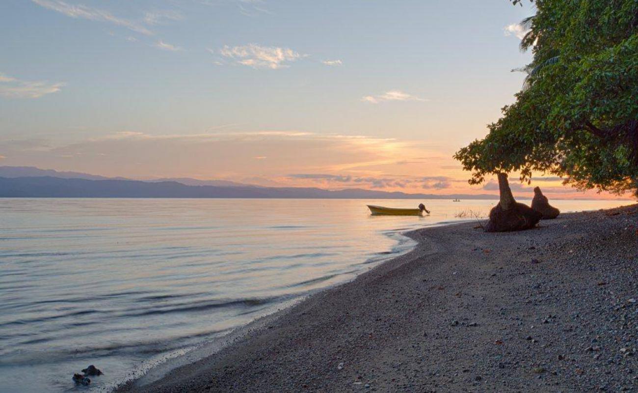 Photo of Playa Juanito Mora with brown pebble surface