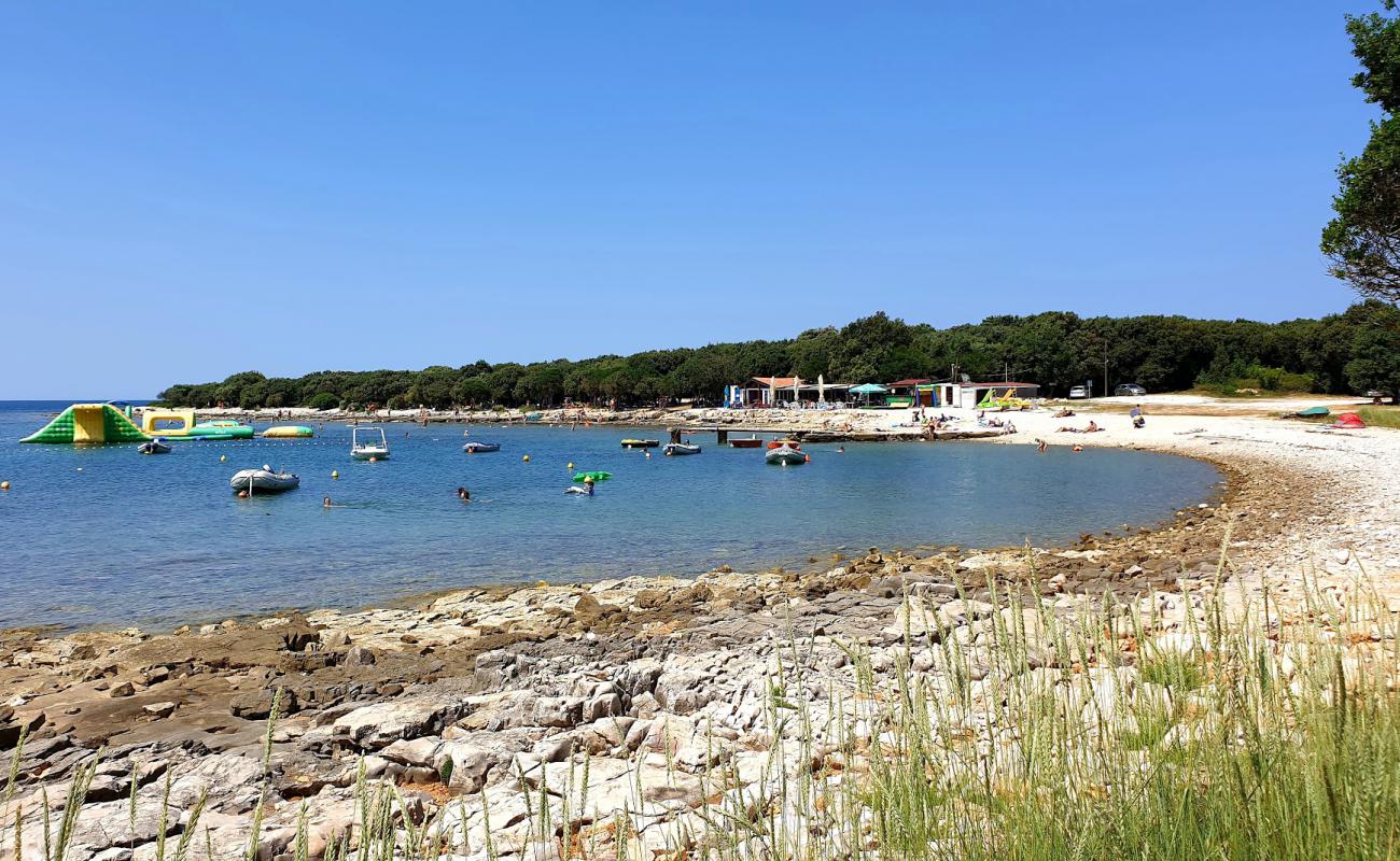 Photo of Meneghetti beach with light pebble surface