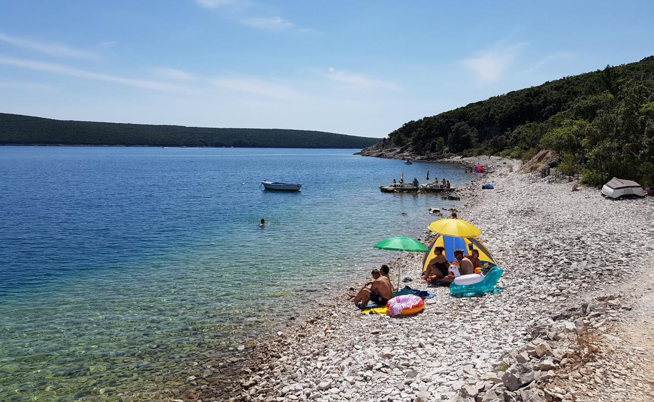 Photo of Kalavojna beach with rocks cover surface