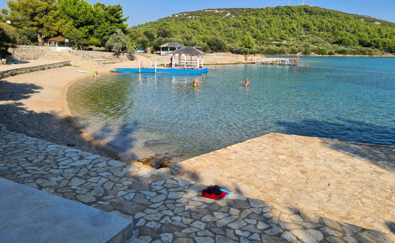 Photo of The Garden Tisno beach with light fine pebble surface