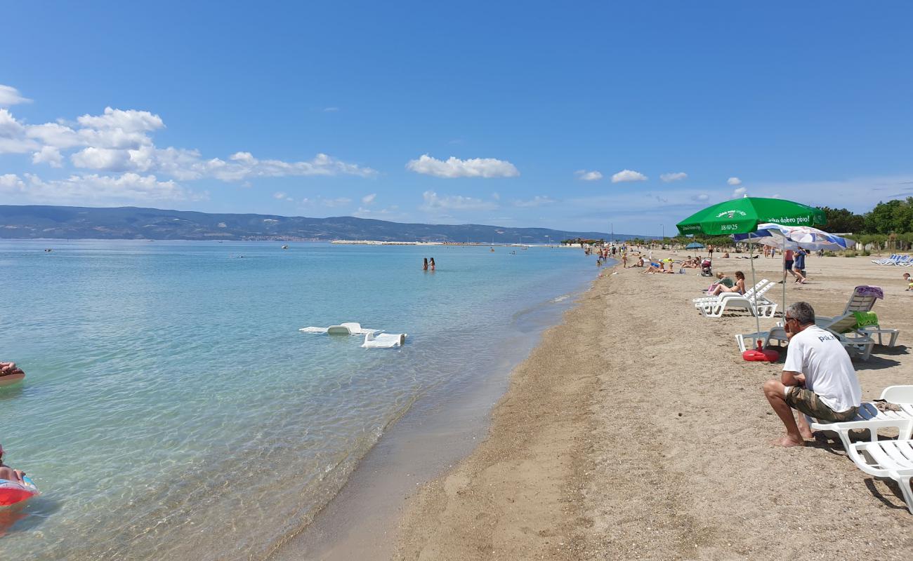 Photo of Omis beach with brown sand surface