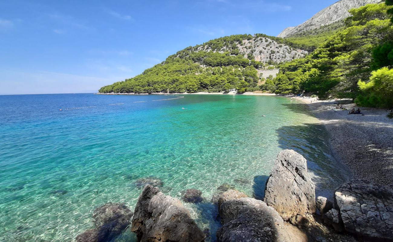 Photo of Duba beach with light fine pebble surface