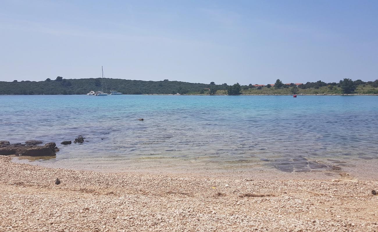 Photo of Kamenica beach with bright sand & rocks surface