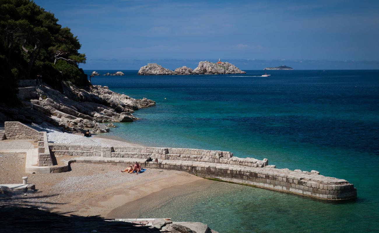 Photo of Vila beach with light pebble surface