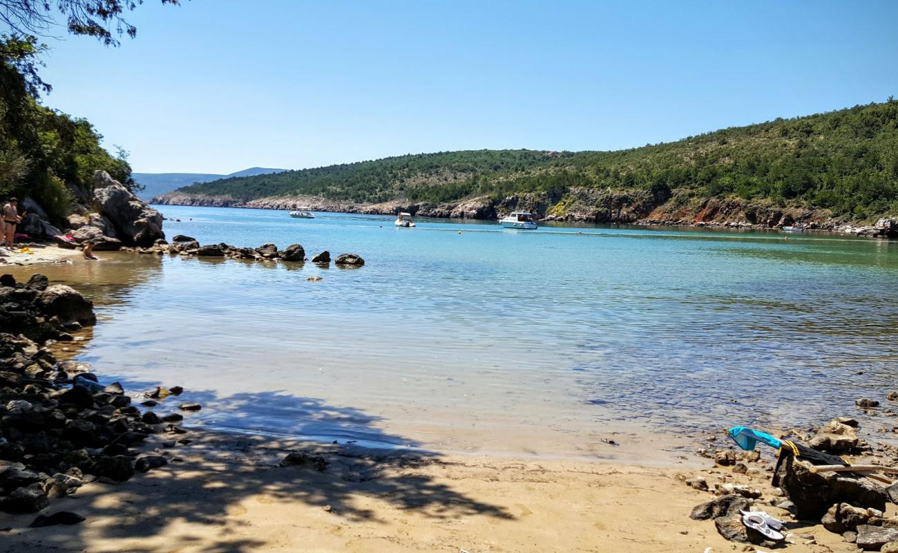 Photo of Petrina beach with bright sand & rocks surface