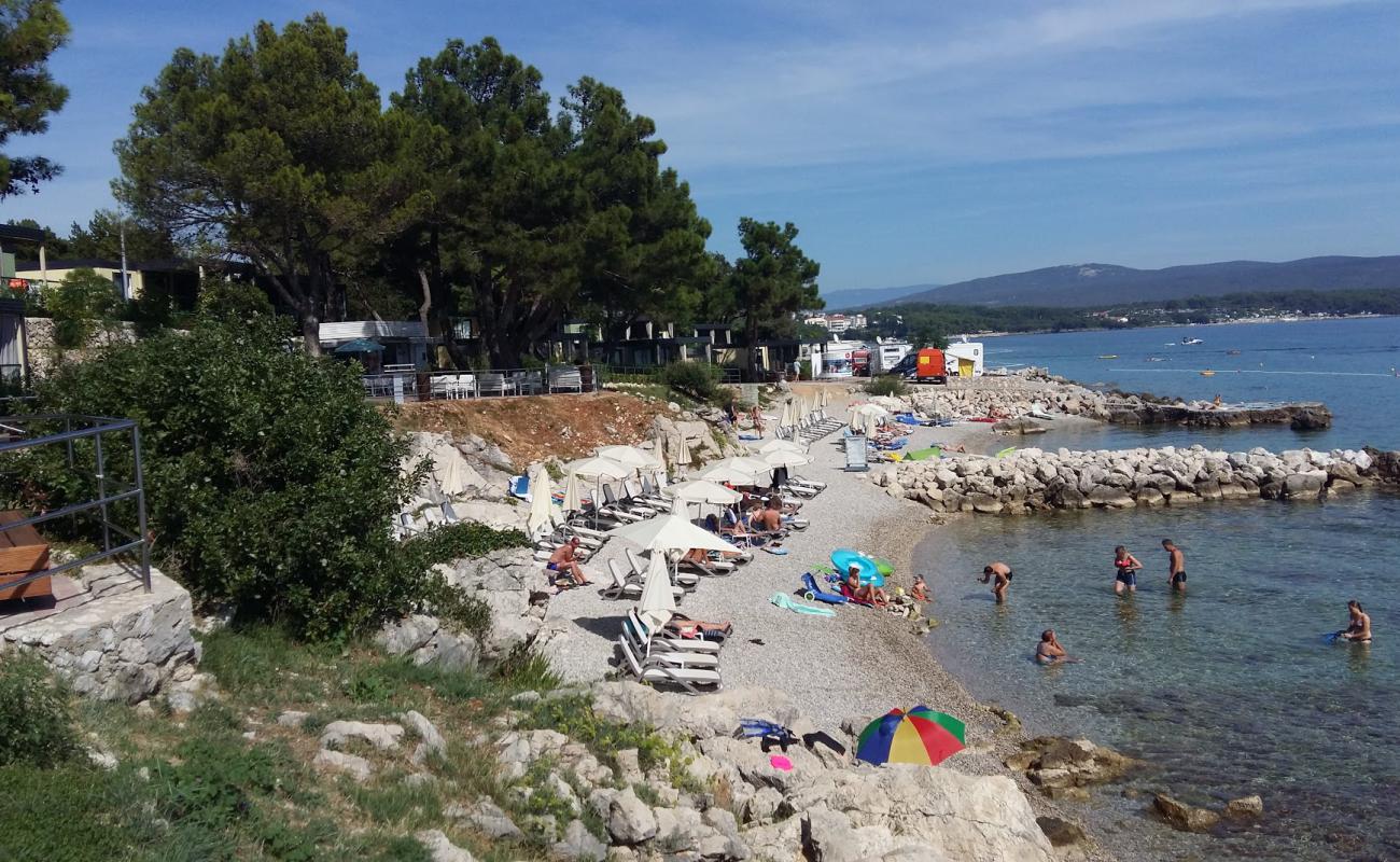 Photo of Karaka beach with light fine pebble surface