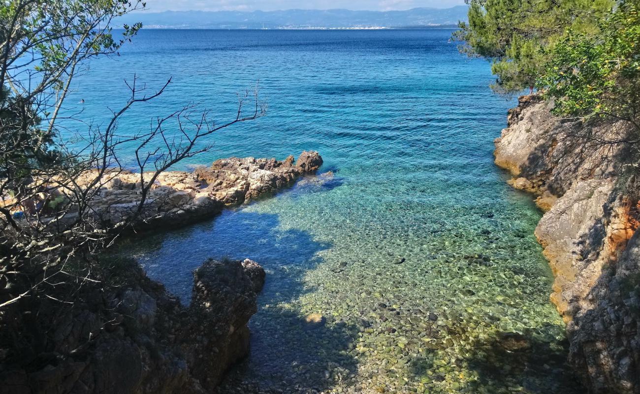 Photo of Malinska-Porat beach with rocks cover surface