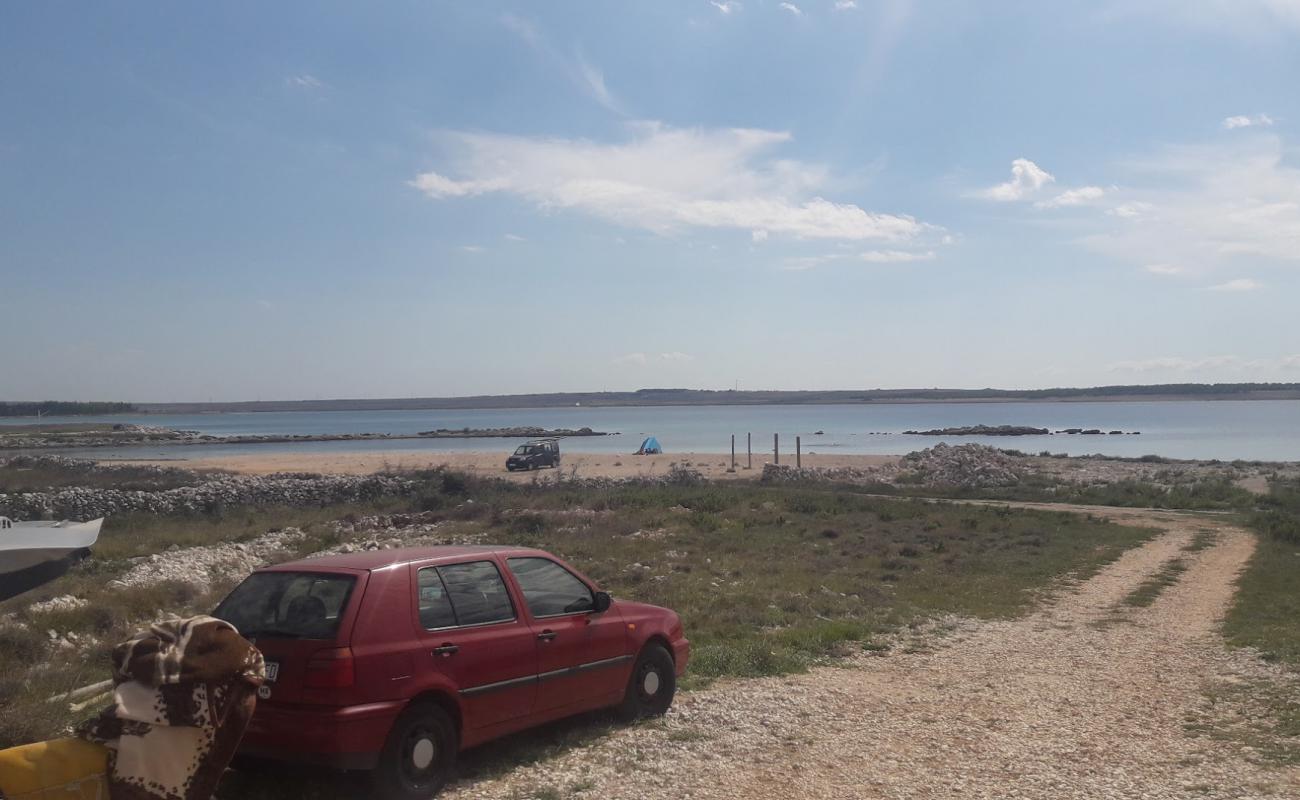 Photo of Pag beach with rocks cover surface