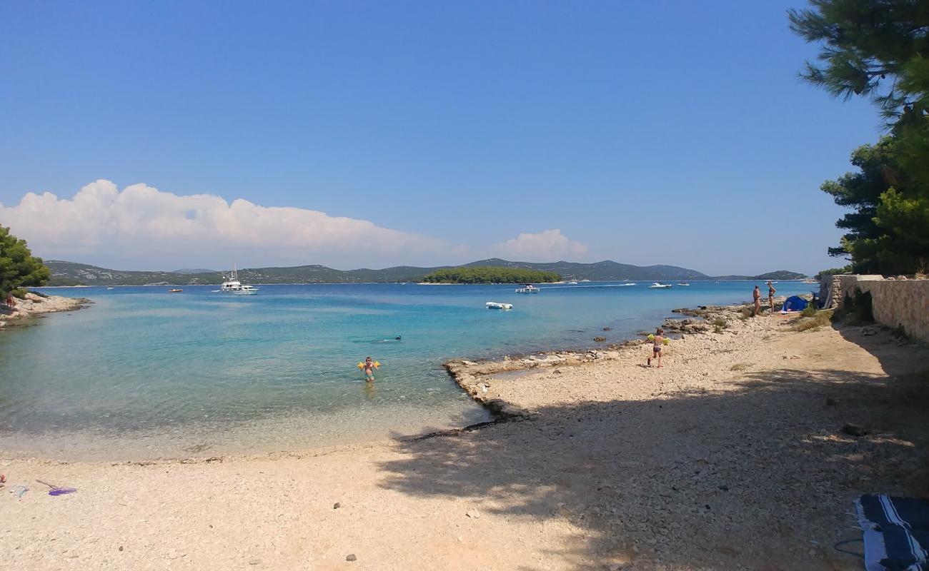 Photo of Guscica beach with rocks cover surface