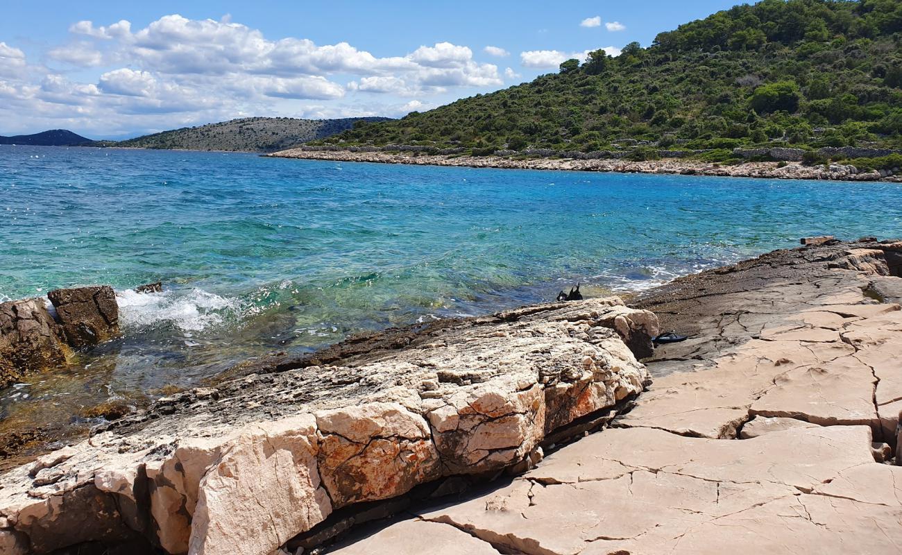 Photo of Portic beach with rocks cover surface