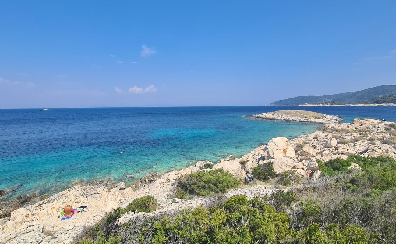 Photo of Komarca beach with rocks cover surface