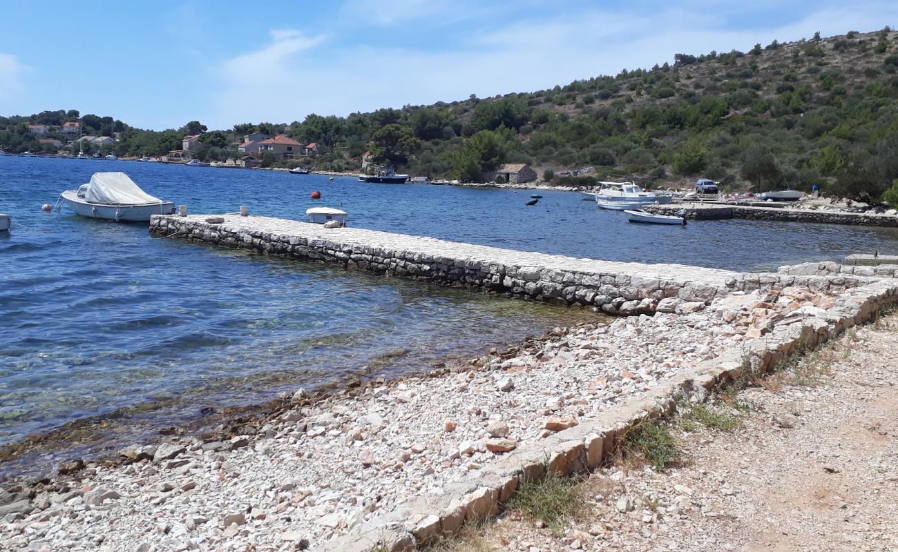 Photo of Porto Rosso beach with light fine pebble surface