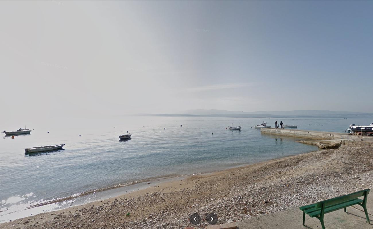 Photo of Racic beach with turquoise water surface