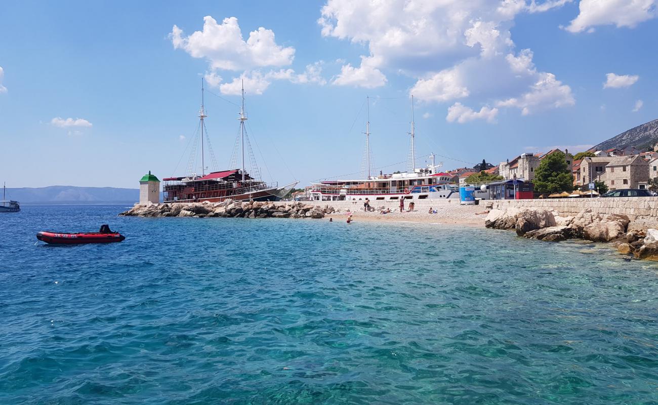 Photo of Port Bol beach with light pebble surface