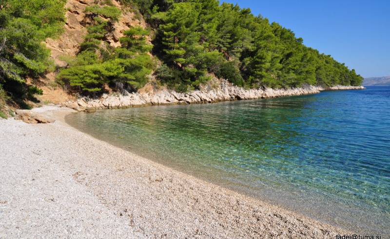 Photo of Brusje beach with light pebble surface