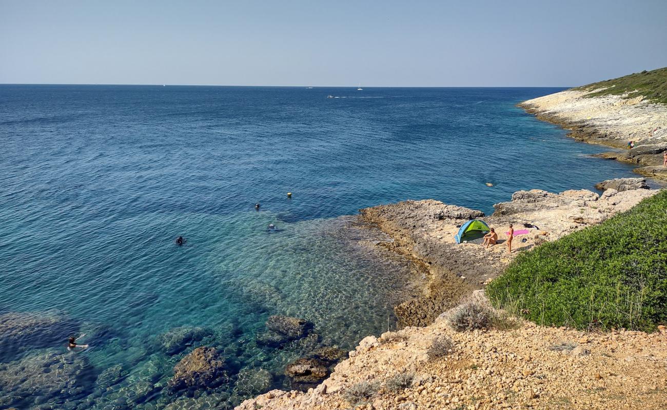 Photo of Crvene Stijene FKK Beach with rocks cover surface