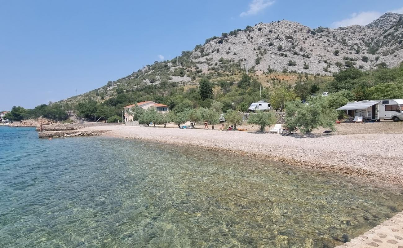 Photo of Zalo Beach with rocks cover surface