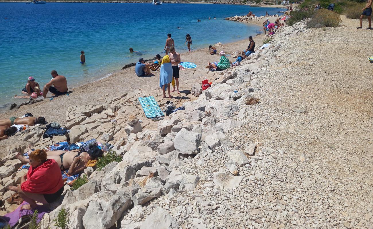 Photo of Lavdara Beach with bright sand & rocks surface