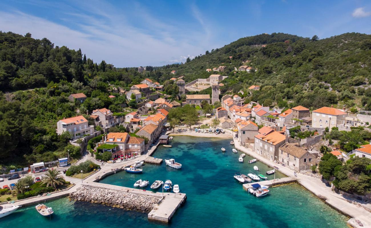 Photo of Port of Sudurad with rocks cover surface