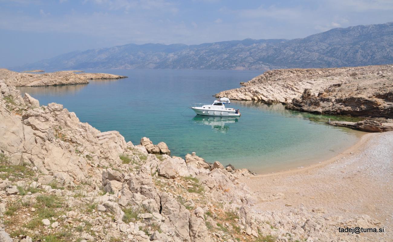 Photo of Slana Bay with rocks cover surface