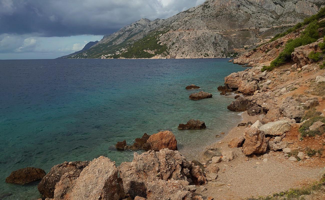 Photo of Vruja FKK Beach with rocks cover surface