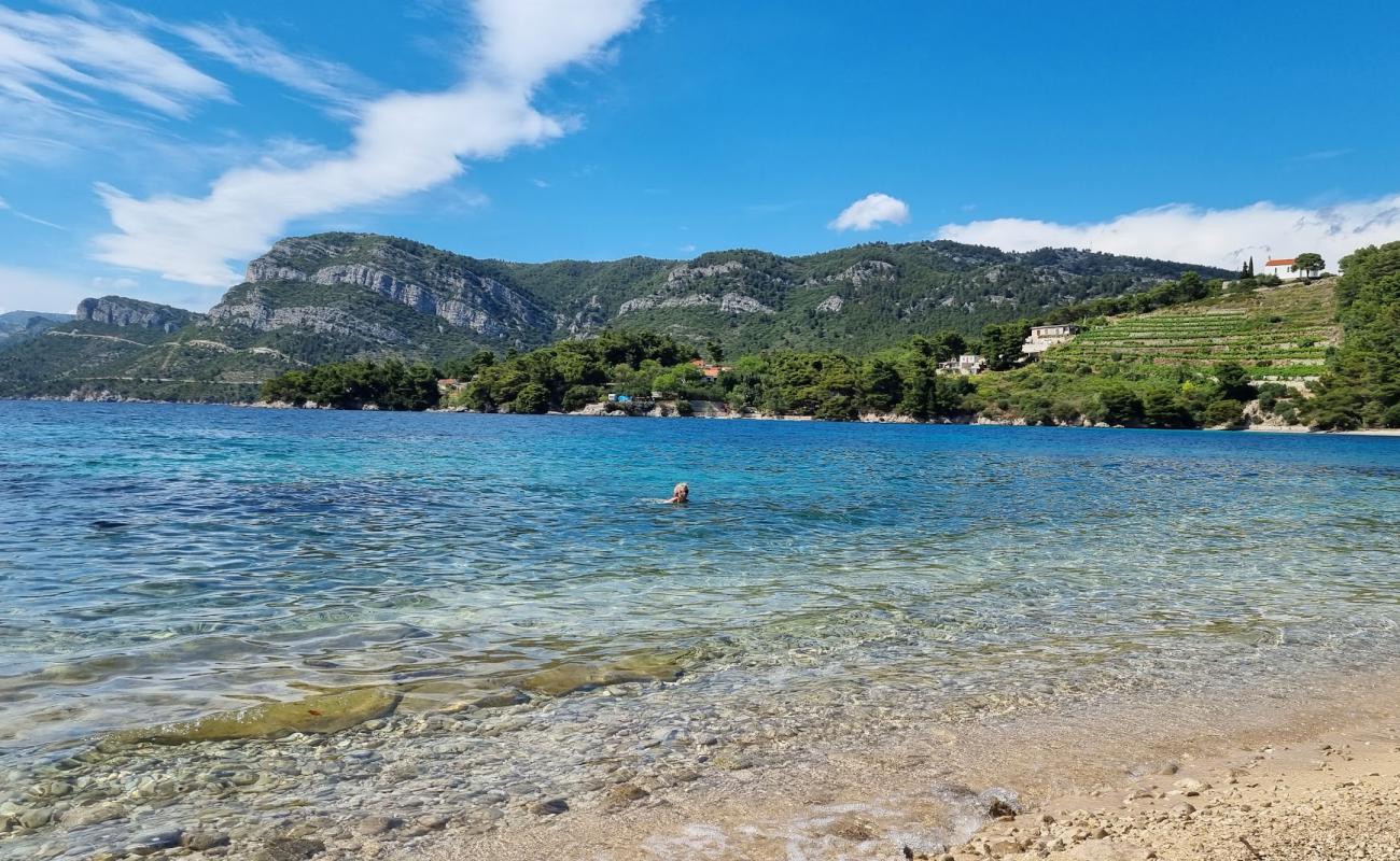 Photo of Vucine FKK Beach with bright sand & rocks surface