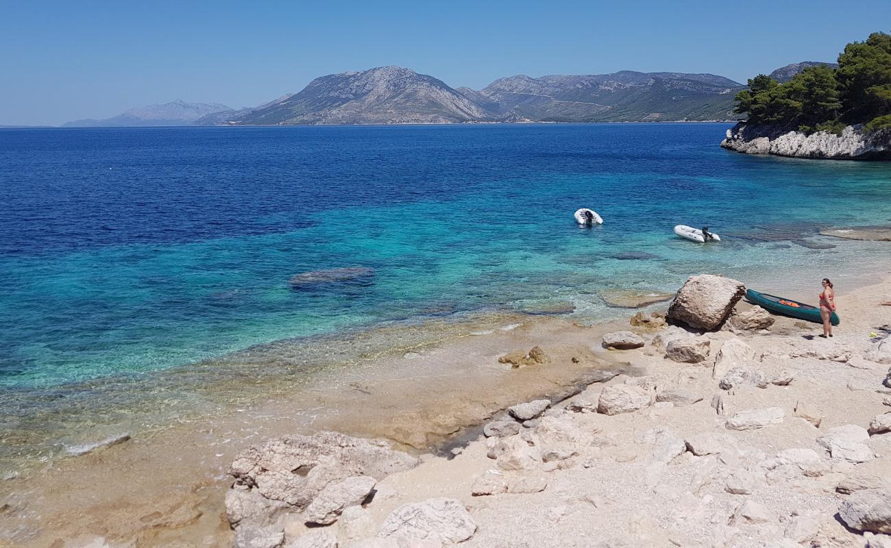 Photo of Secret Beach Zuljana with bright sand & rocks surface