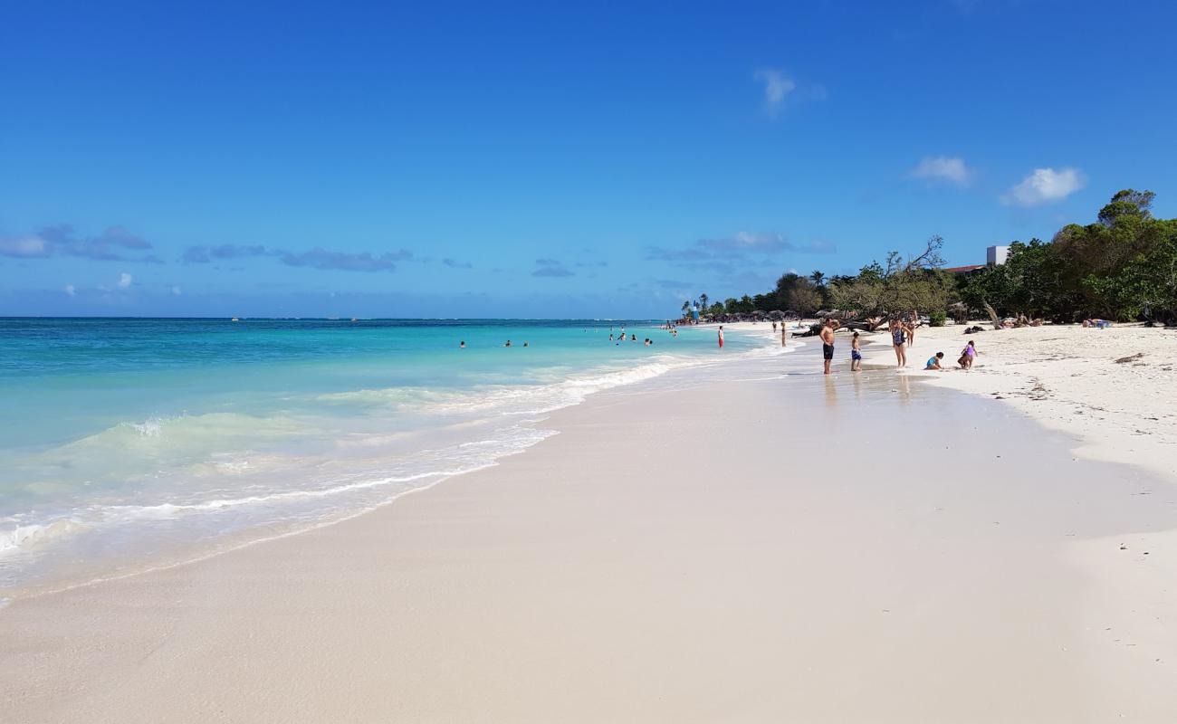 Photo of Guardalavaca Beach with white fine sand surface