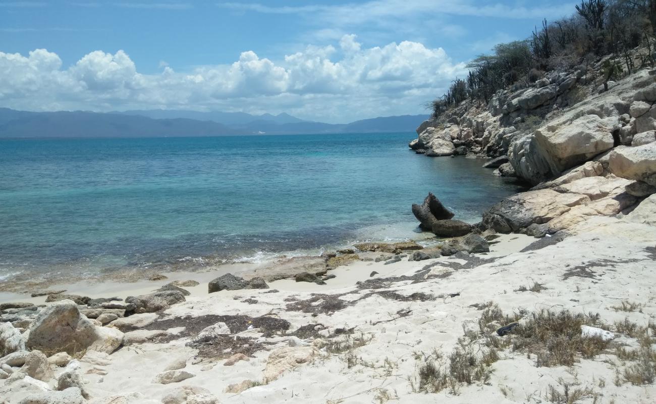 Photo of Pirates Cave beach with bright sand & rocks surface