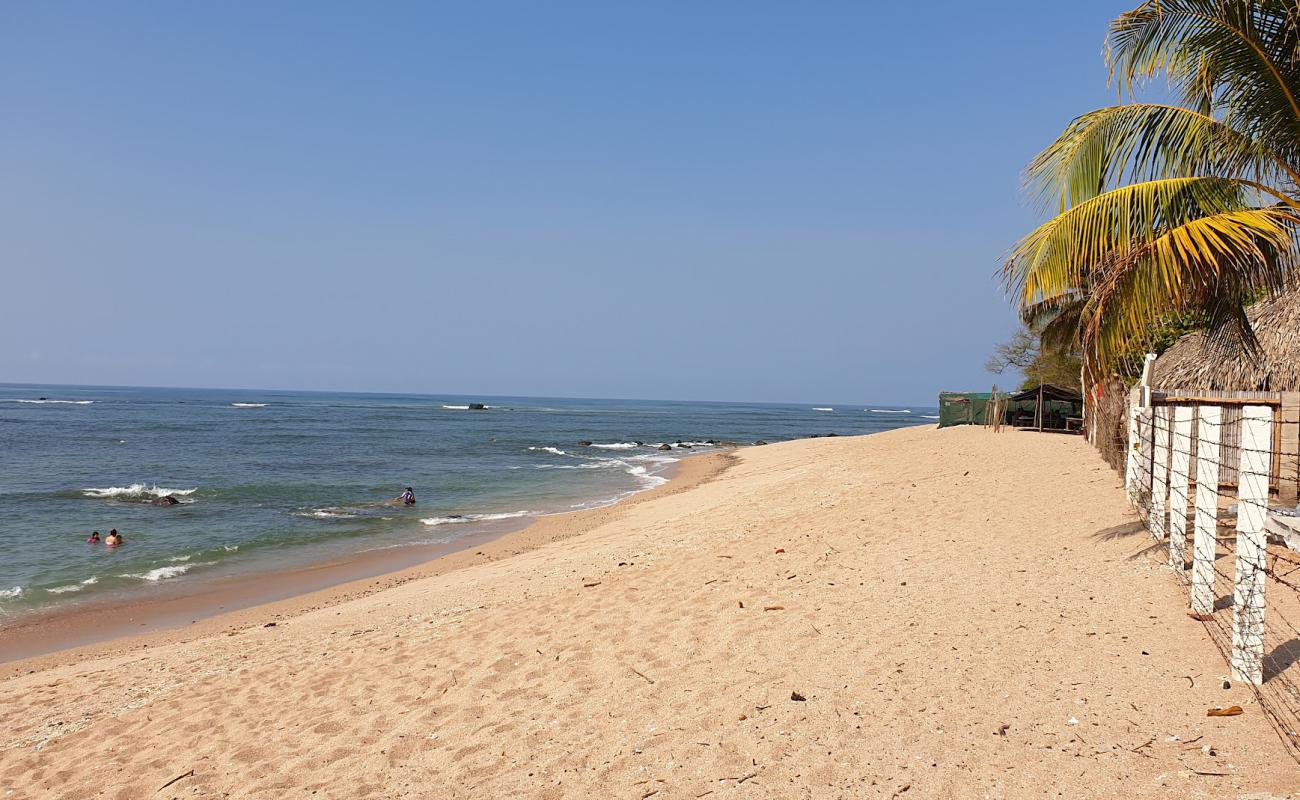 Photo of Cobanos beach with bright sand & rocks surface