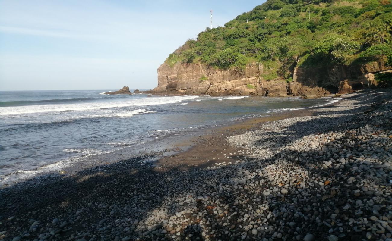 Photo of La Perla beach with gray pebble surface