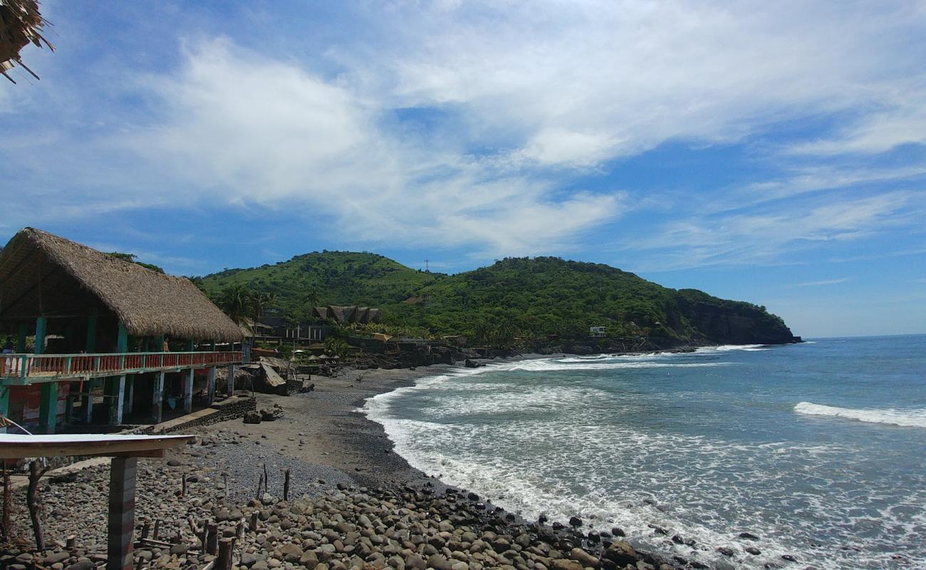 Photo of El Zonte beach with gray sand &  pebble surface