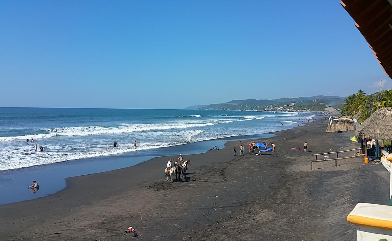 Photo of El Majahual beach with gray sand surface