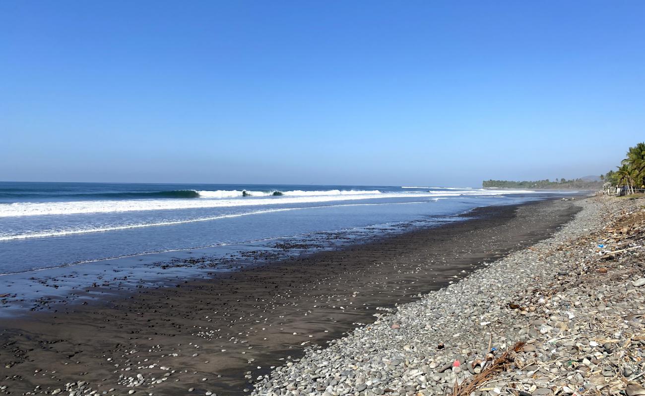 Photo of ASOB Conchalio beach with gray sand &  pebble surface