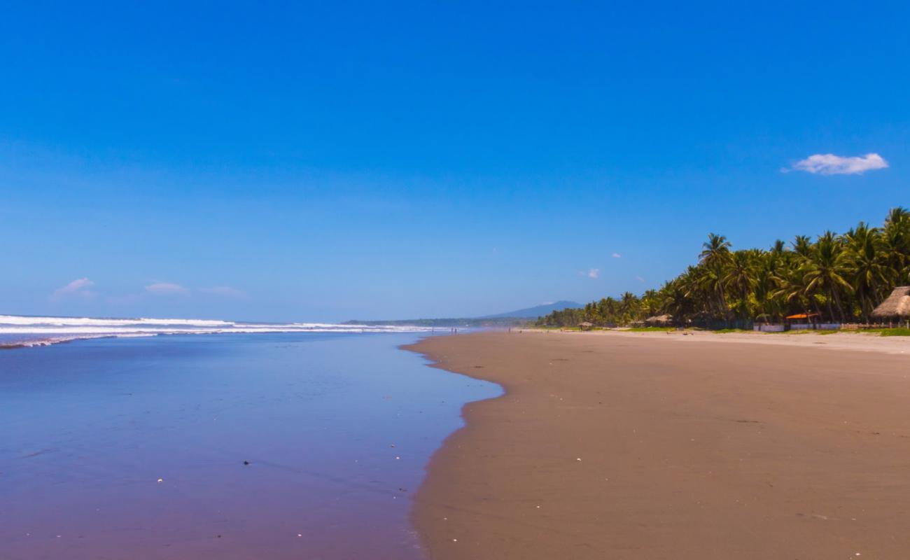 Photo of Los Caracoles beach with gray sand surface