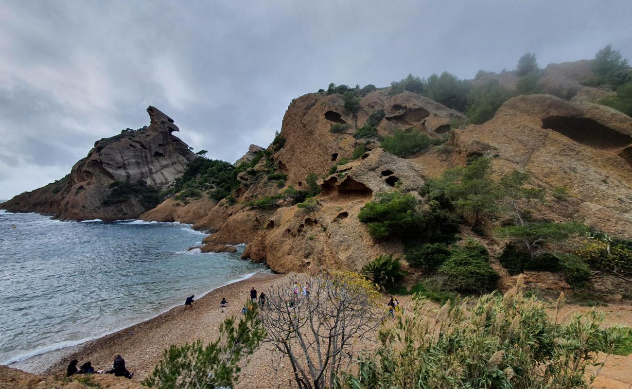 Photo of Calanque de Figuerolles with brown sand &  rocks surface