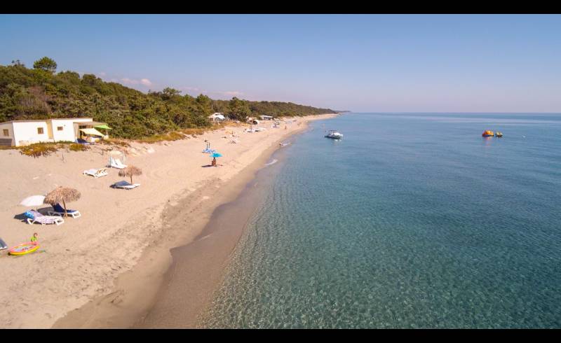 Photo of Stintino beach with bright sand surface